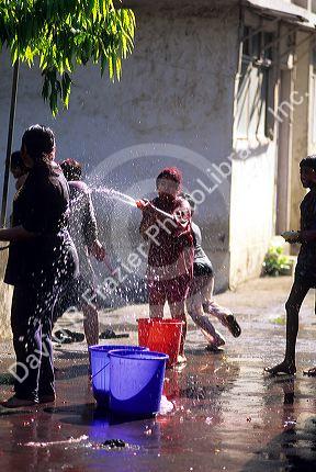 Indian children have a water fight during the Holi Festival in India.