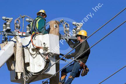 Electric power lineman installing new lines in Boise, Idaho.