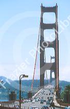 Automobiles traveling across the Golden Gate Bridge in San Francisco, California.