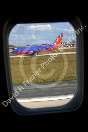 Southwest Airlines Boeing 737 seen through the window of an airliner.