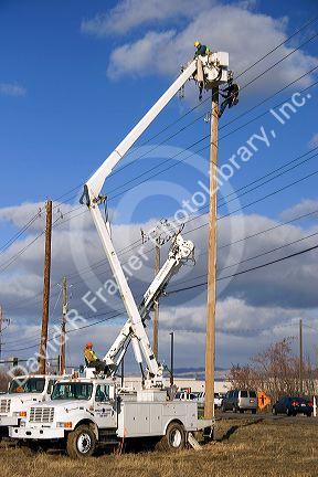 Electric power lineman installing new lines in Boise, Idaho.