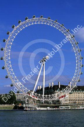 The London Eye ferris wheel along the River Thames in London, England.