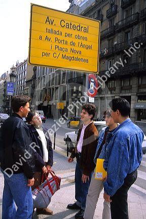 Spanish boys socialize on the street in Spain.