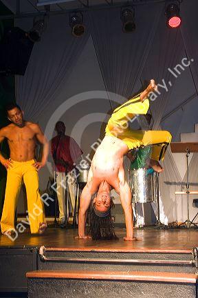 Men perform a martial arts dance called  Capoeira at a nightclub in Sao Paulo, Brazil.