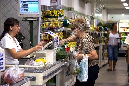 Customer in the checkout line at a supermarket in Rio de Janeiro, Brazil.