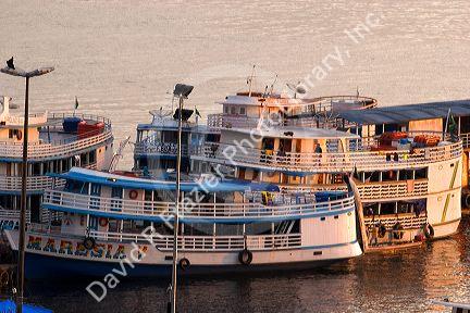 Amazon river boats docked at sunrise in Manaus, Brazil.