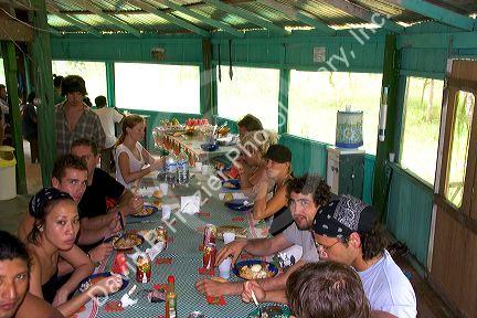Guests share a meal at a lodge in the Amazon jungle near Manaus, Brazil.