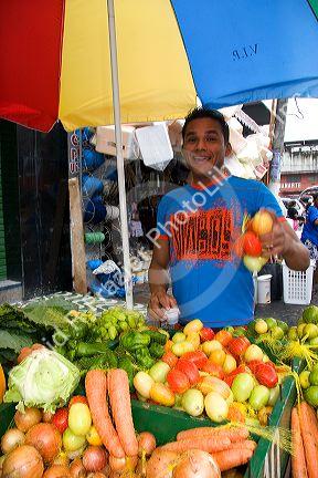 Street vendor selling produce in Manaus, Brazil.