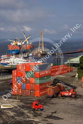 Container ship and containers at the port in Manaus, Brazil.