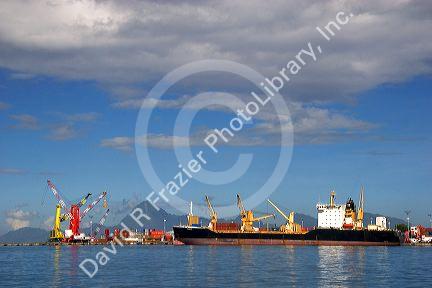 Container ship in the harbor at Papeete on the island of Tahiti.