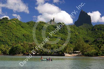A boat in the lagoon and the island of Moorea.