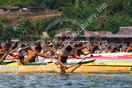 Tahitians take part in an outrigger canoe pirogue race off the island of Moorea.
