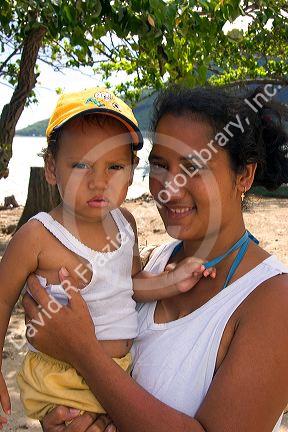 Tahitian woman and child on the island of Moorea.