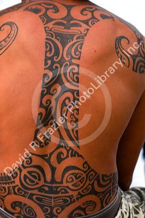 Tahitian man with a tradional tattoo on the island of Moorea.