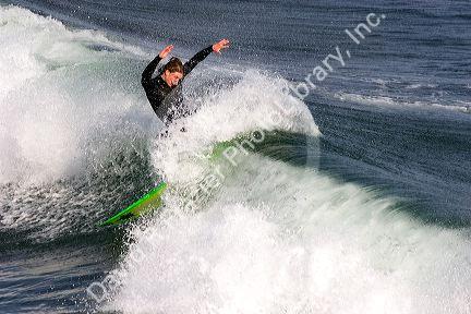 Surfing in the pacific ocean on the California coast at Santa Cruz.