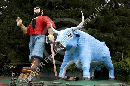 Giant statues of Paul Bunyan and Babe the Blue Ox guard the entrance of Trees of Mystery in Klamath, California.