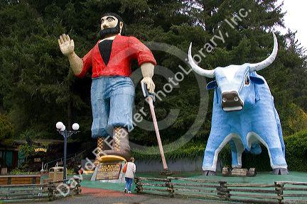 Giant statues of Paul Bunyan and Babe the Blue Ox guard the entrance to the Trees of Mystery at Klamath, California.