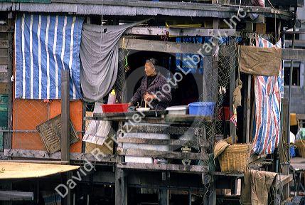 Woman in a fishing village, Hong Kong.