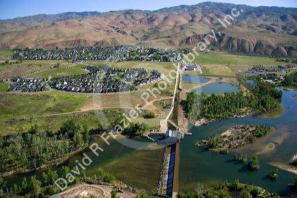 Aerial view of historic Barber Dam on the Boise River and Harris Ranch subdivision in Boise, Idaho.