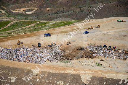 Aerial view of trucks and tractors working at the sanitary landfill in Boise, Idaho.