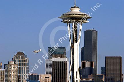 Sea plane flying over the city of Seattle and the Space Needle in Washington.
