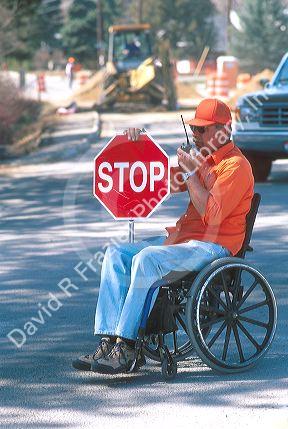 Handicapped traffic flagger.
