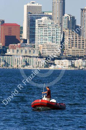 Zodiac boat in Elliott Bay with the city of Seattle, Washington in the background.