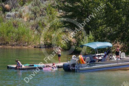 Patio boat docked at Lucky Peak Reservior near Boise, Idaho.