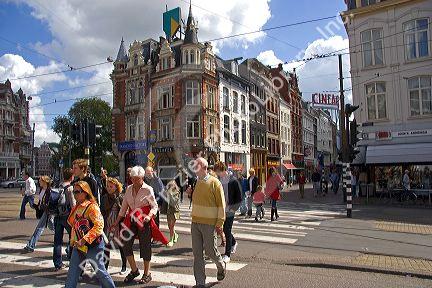 Pedestrians crossing the street in Amsterdam, Netherlands.