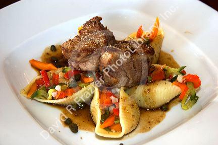 A meal of pork and vegetable stuffed pasta at a restaurant in Amsterdam, Netherlands.