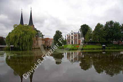 The Eastern Gate and centre along a canal in the city of Delft in the province of South Holland, Netherlands.
