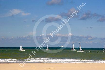 Sailboats in the Strait of Dover in the English Channel at Calais in the department of Pas-de-Calais, France.