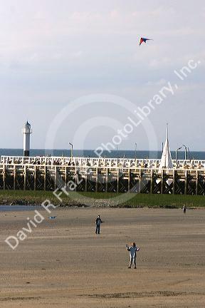 People flying kites on the beach at Nieuwpoort in the province of West Flanders, Belgium.