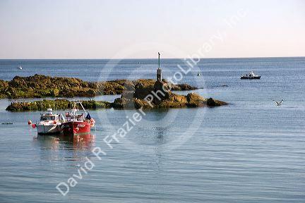 Fishing boats in the harbor at the commune of Barfleur in the region of Basse-Normandie, France.