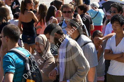 Tourists wait in line at The Palace of Versailles at Versailles in the department of Yvelines, France.