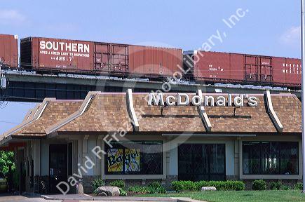 A freight train traveling past a McDonald's fast food restaurant in Covington, Kentucky.