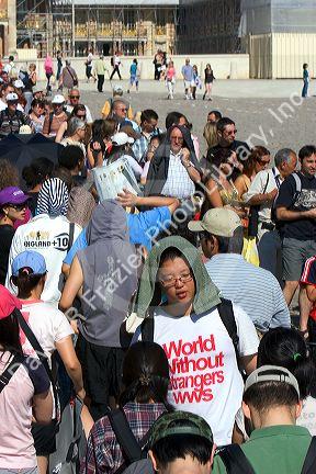 Tourists wait in line at the Palace of Versailles in Versailles in the department of Yvelines, France.