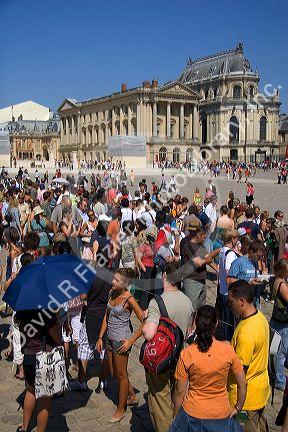Tourists wait in a line at The Palace of Versailles at Versailles in the department of Yvelines, France.