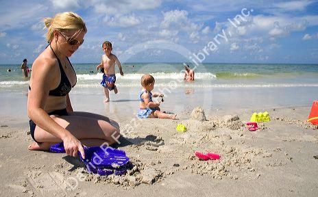 Family plays at the beach in St. Petersburg, Florida. MR