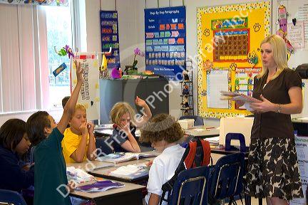 Teacher and fourth grade students in a classroom at a public school in Tampa, Florida.