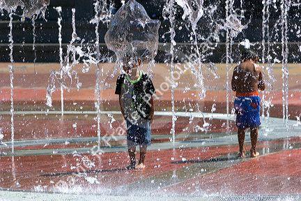 Children play in the Fountain of Rings in Centennial Olympic Park, Atlanta, Georgia.