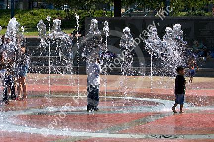 Children play in the Fountain of Rings in Centennial Olympic Park, Atlanta, Georgia.