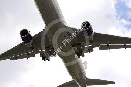 The underside of a Boeing 757 airplane in flight.