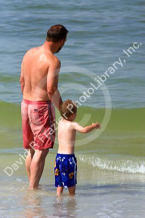 Father and son entering the water at St. Petersburg, Florida. MR