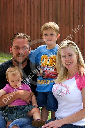 Family portrait with mother, father, son, and daughter in Florida. MR