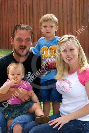 Family portrait with mother, father, son, and daughter in Florida. MR