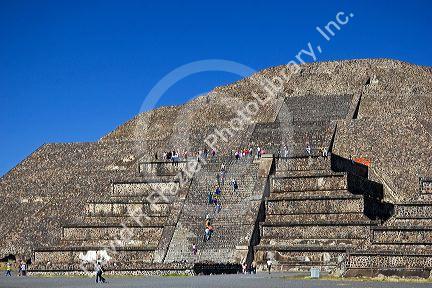People climb the steps of the Pyramid of the Moon at Teotihuacan in the State of Mexico, Mexico.