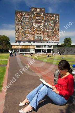 Female student studying in front of the Central Library on the campus of the National Autonomous University of Mexico in Mexico City, Mexico. MR