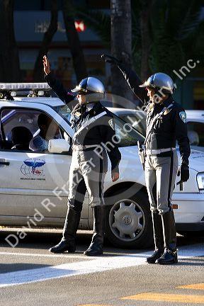 Female police officers directing traffic in Mexico City, Mexico.