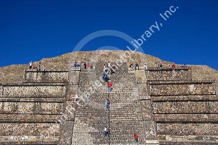 Tourists climb the steps of the Pyramid of the Moon at Teotihuacan in the State of Mexico, Mexico.